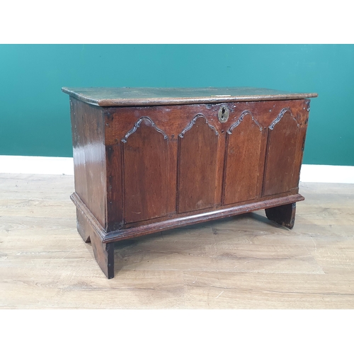 12 - An antique oak Childs Coffer with carved fielded four panel front, 1ft 10