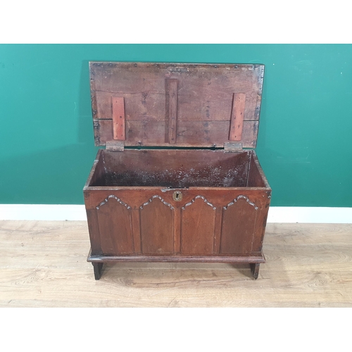 12 - An antique oak Childs Coffer with carved fielded four panel front, 1ft 10