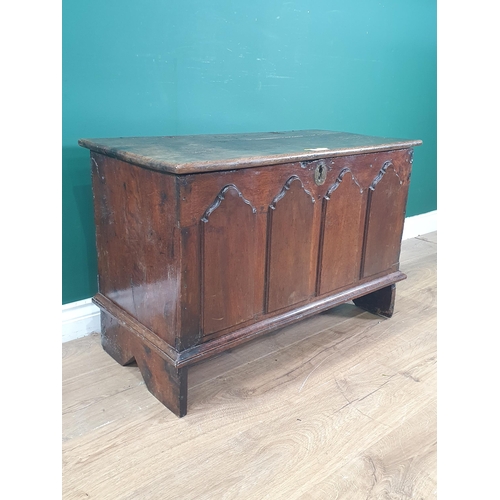 12 - An antique oak Childs Coffer with carved fielded four panel front, 1ft 10