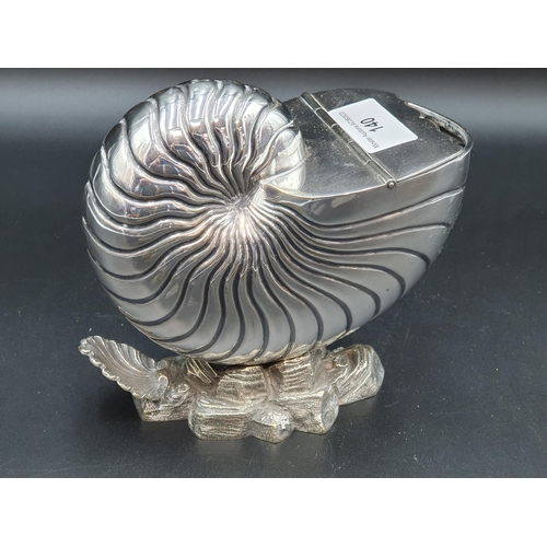 140 - A plated Spoon Warmer in the form of a nautilus shell