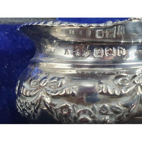 146 - A pair of Victorian silver Salts with floral swag and ribbon embossing, blue glass liners and two Sp... 