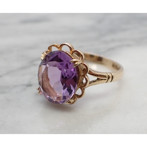 163 - An Amethyst Dress Ring claw-set oval-cut stone in 9ct gold, ring size N 1/2