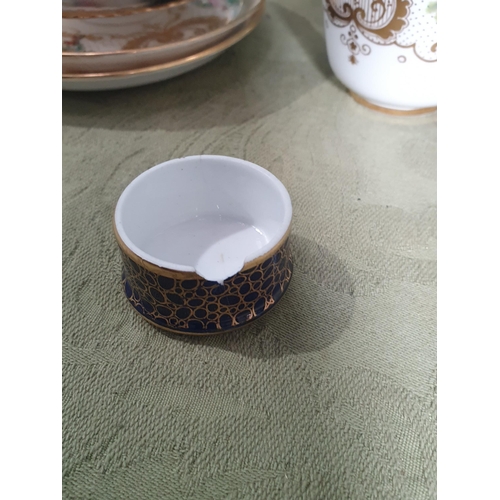 219 - A small Coalport Teapot with sprays of flowers, gilding and deep blue ground, cracks to base and spo... 