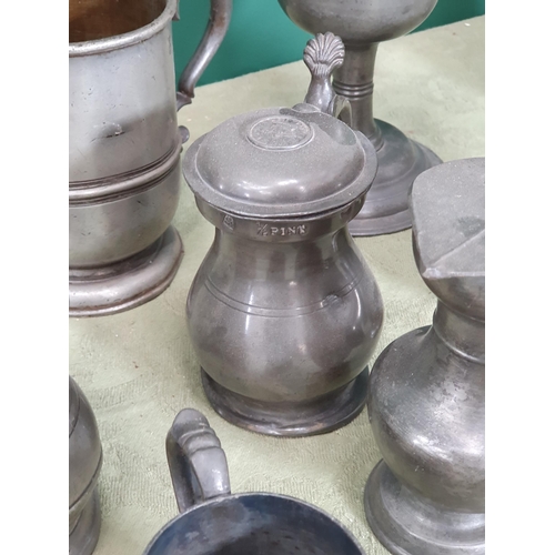 228 - A quantity of pewter including pedestal Mugs, Goblet, Tankards, Inkwell, Salt, Bell, etc, (R7)