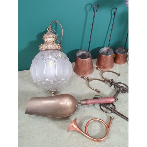 229 - A brass adjustable Table Lamp with coloured glass shade, three copper Cider Measures, a brass Shovel... 