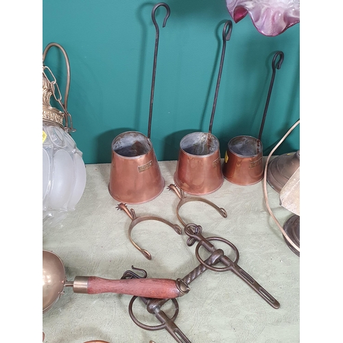 229 - A brass adjustable Table Lamp with coloured glass shade, three copper Cider Measures, a brass Shovel... 