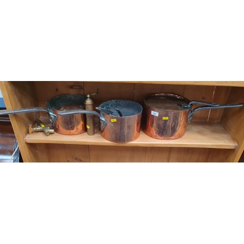 250 - A group of copper Items including Saucepans, Saucepan Covers, Jelly Mould, an Eastern brass cylindri... 