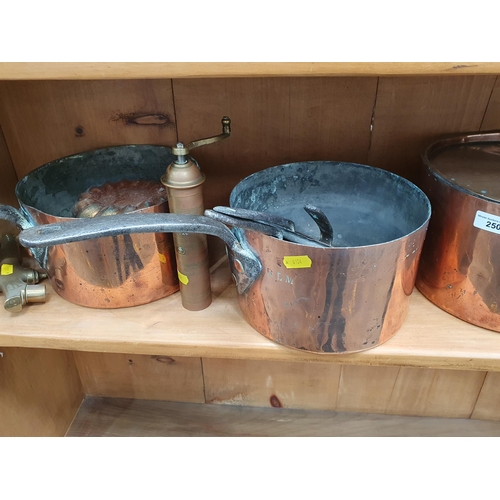 250 - A group of copper Items including Saucepans, Saucepan Covers, Jelly Mould, an Eastern brass cylindri... 