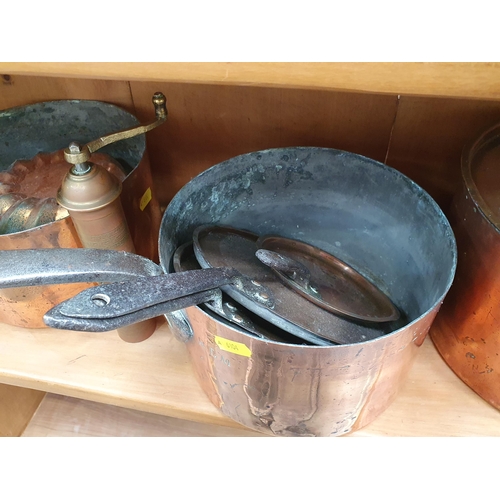 250 - A group of copper Items including Saucepans, Saucepan Covers, Jelly Mould, an Eastern brass cylindri... 