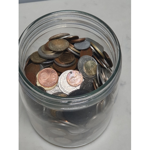 255 - A jar of British and World Coins, to include a 1788 Parys Mines Druid Head Penny Token, and a George... 