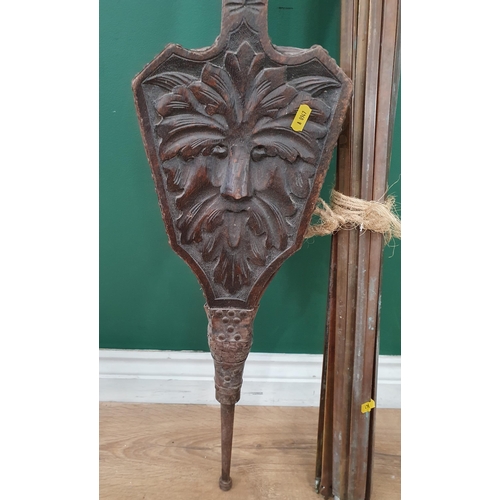 277 - A pair of carved oak Bellows with Greenman decoration and a quantity of brass Stair Rods. (R9).