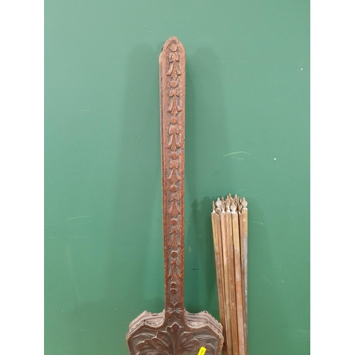 277 - A pair of carved oak Bellows with Greenman decoration and a quantity of brass Stair Rods. (R9).