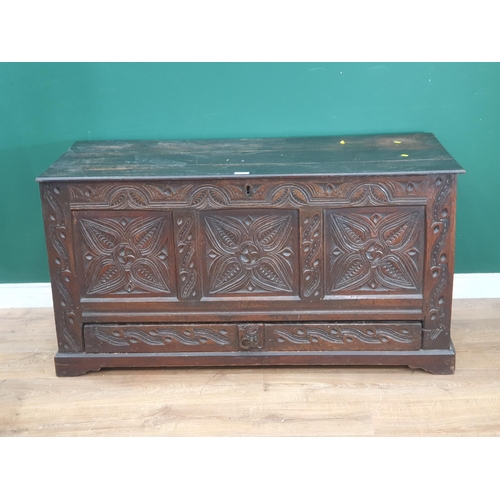 28 - A stained oak Mule Chest with carved three panel front, above single fitted drawer, 2ft 4