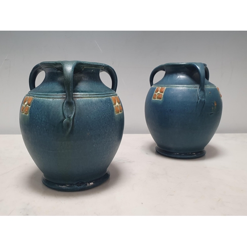 283A - A Pair of studio style three handled pottery vases