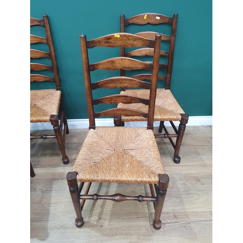 29 - A set of seven rush seated Ladderback Chairs (R3)