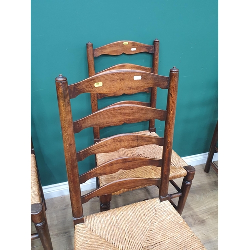 29 - A set of seven rush seated Ladderback Chairs (R3)