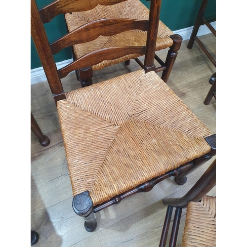 29 - A set of seven rush seated Ladderback Chairs (R3)