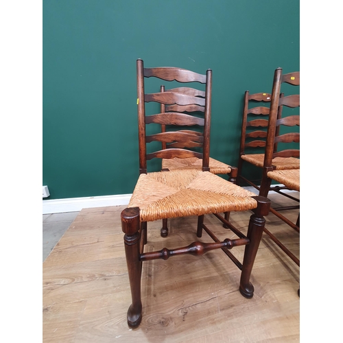 29 - A set of seven rush seated Ladderback Chairs (R3)