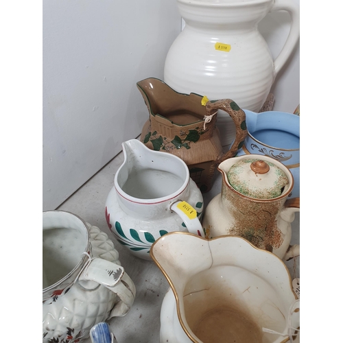 349 - A cream Royal Cauldon Jug, a Wapeheath No 3074 floral decorated Jug, a Myott & Son style Lidded Wate... 