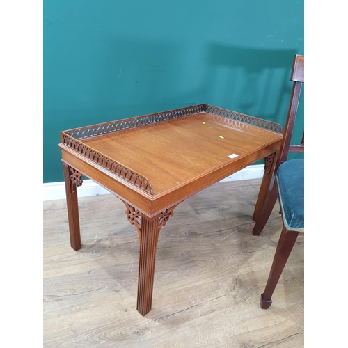 35 - A reproduction mahogany Coffee Table with raised pierced gallery on chamfered supports, 1ft 10