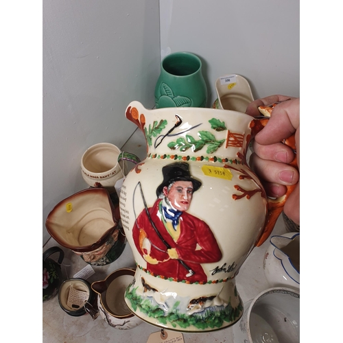 356 - A collection of Jugs including four Crown Devon Musical Jugs, a Royal Doulton musical Character Jug ... 