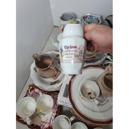 361 - A quantity of pottery and porcelain including Commemorative Mugs, an ironstone type Serpent Jug, a J... 