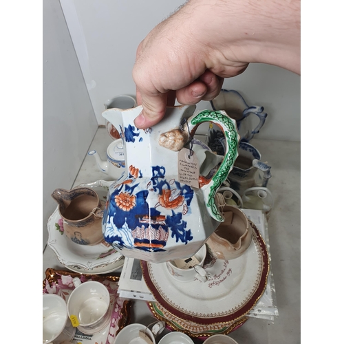 361 - A quantity of pottery and porcelain including Commemorative Mugs, an ironstone type Serpent Jug, a J... 