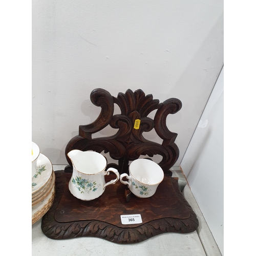 365 - A carved oak Wall Bracket and a Royal Stafford part Tea Set