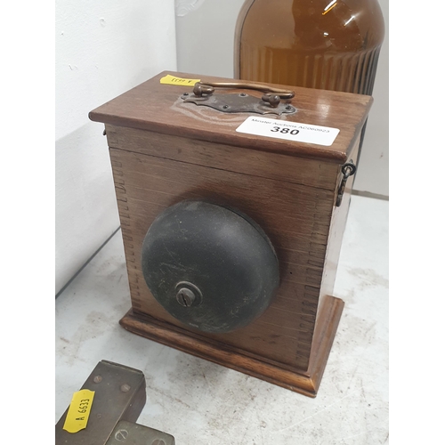 380 - A brown glass Chemist's Bottle and Stopper, 11in H, a box-mounted House Bell and two Spirit Levels