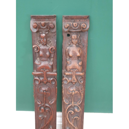 42 - A near pair of 17th Century Caryatids with carved figure and scrolled decorations, 1ft 9