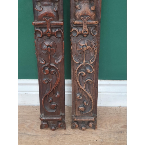 42 - A near pair of 17th Century Caryatids with carved figure and scrolled decorations, 1ft 9