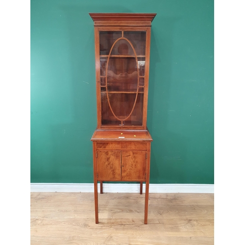 481 - A mahogany Glazed Cabinet with satinwood stringing, the single door enclosing two adjustable shelves... 