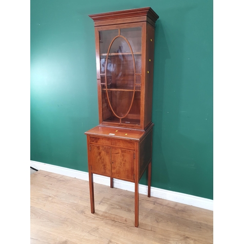 481 - A mahogany Glazed Cabinet with satinwood stringing, the single door enclosing two adjustable shelves... 