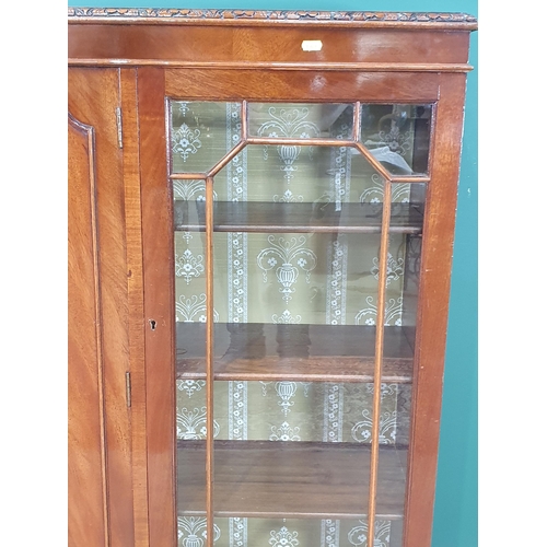 491 - A reproduction mahogany Glazed Bookcase/Display Cabinet, the pair of glazed doors enclosing adjustab... 