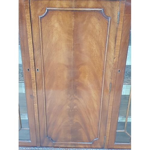 491 - A reproduction mahogany Glazed Bookcase/Display Cabinet, the pair of glazed doors enclosing adjustab... 