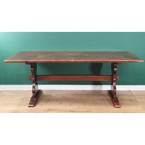 497 - A reproduction oak Refectory Table on shaped supports united by central stretcher 2ft 6