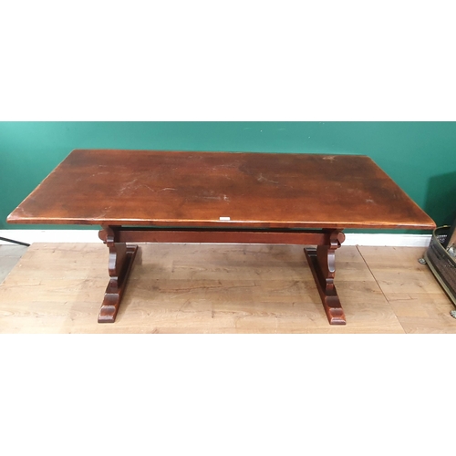 497 - A reproduction oak Refectory Table on shaped supports united by central stretcher 2ft 6