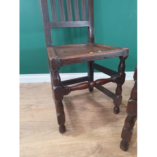 5 - A pair of 17th Century oak Hall Chairs with crown and leafage carved cresting rail and gouge moulded... 