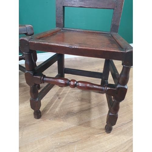 5 - A pair of 17th Century oak Hall Chairs with crown and leafage carved cresting rail and gouge moulded... 