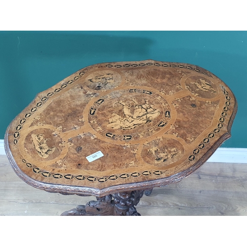 505 - A Victorian walnut Occasional Table with designs of Ibex and Deer to top mounted upon leafage carved... 