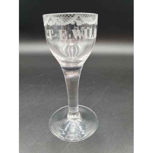 51 - A Georgian Wine Glass with trellis swag engraving and T.E. WILLIS 1775, 5in