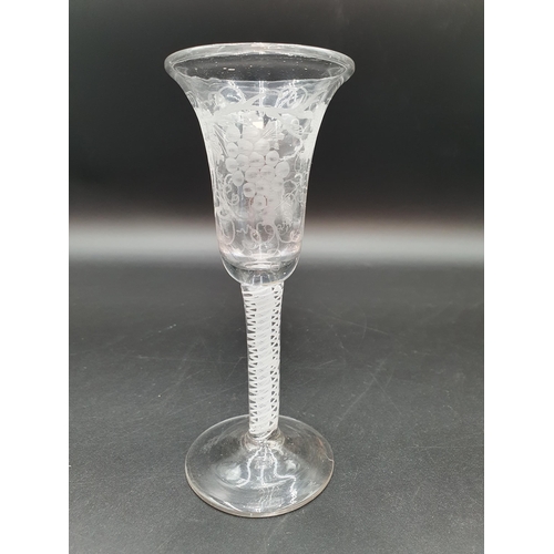 52 - A Georgian Wine Glass with bell-shaped bowl engraved fruiting vine on double series opaque twist ste... 