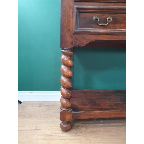 523 - A large modern oak Sideboard fitted five Drawers with open tier underneath raised on twisted support... 