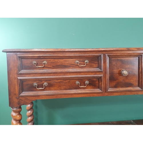 523 - A large modern oak Sideboard fitted five Drawers with open tier underneath raised on twisted support... 