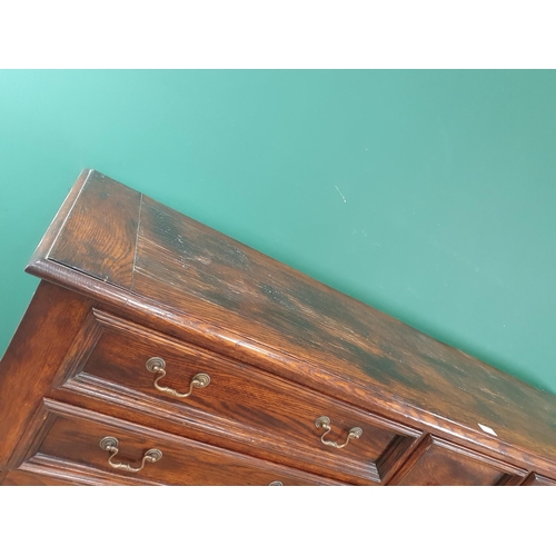 523 - A large modern oak Sideboard fitted five Drawers with open tier underneath raised on twisted support... 