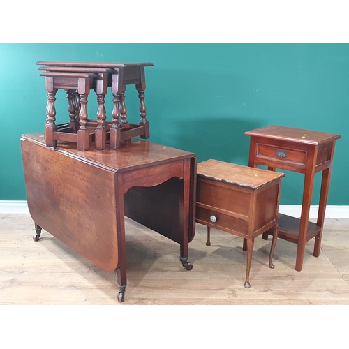 545 - A 19th Century mahogany drop leaf Dining Table, a nest of three oak Occasional Tables, a mahogany Si... 