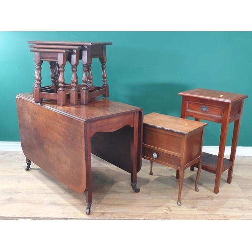 545 - A 19th Century mahogany drop leaf Dining Table, a nest of three oak Occasional Tables, a mahogany Si... 