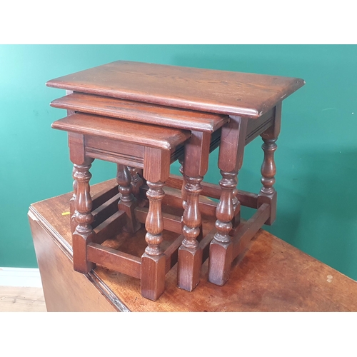 545 - A 19th Century mahogany drop leaf Dining Table, a nest of three oak Occasional Tables, a mahogany Si... 