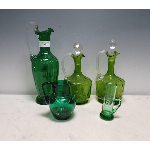 55 - A pair of green glass Flasks with clear fluted handles, a green glass Jug decorated lily of the vall... 