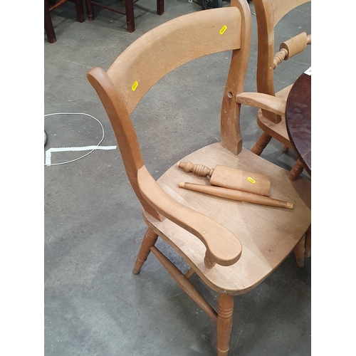 560 - A set of eight  beech Oxford style Kitchen Chairs with bar backs and solid seats, two carvers and si... 